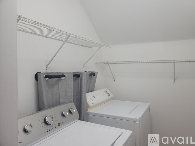A laundry room with a washer and dryer.