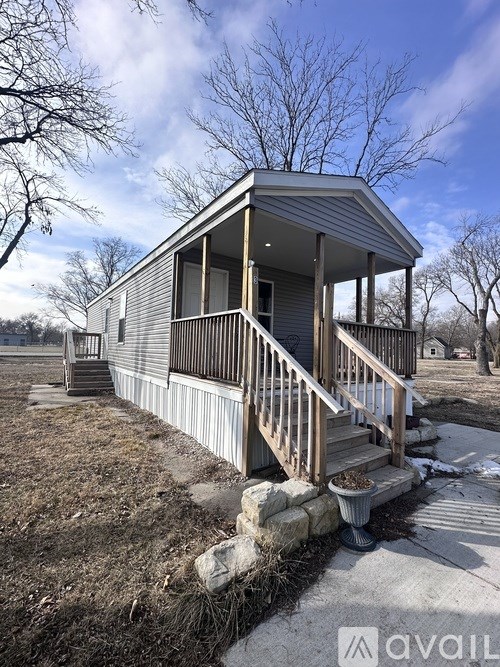 A house with a porch and a covered entrance.