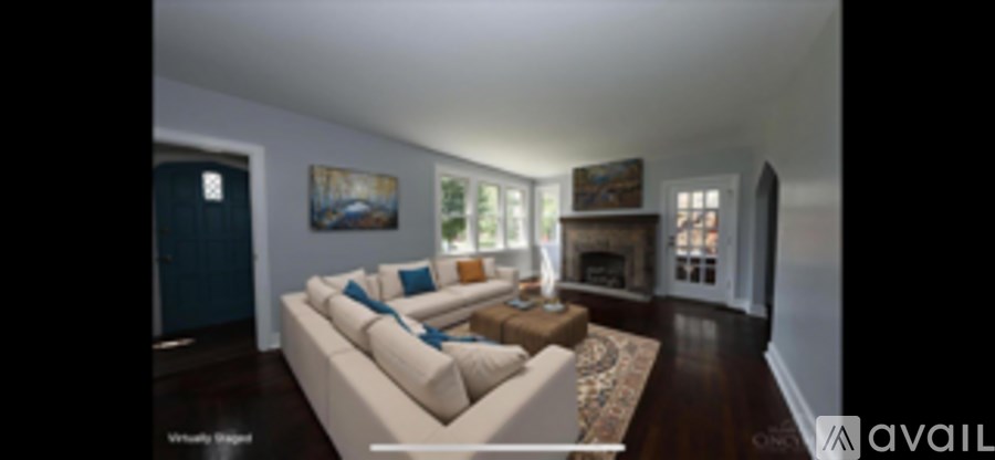 A living room with a couch and a fireplace.