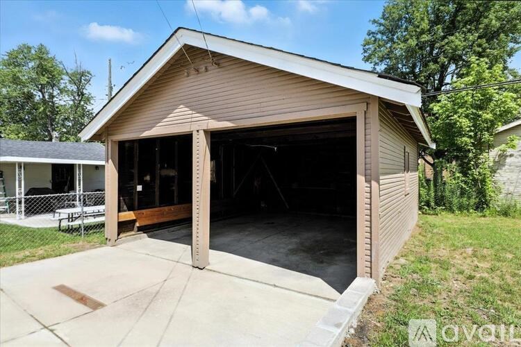 A house with a brown brick exterior is available for sale.