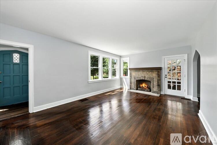 A room with wooden floors and white walls.