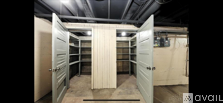 A row of bunk beds in a room with a door open.
