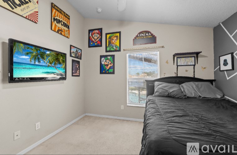 A room with two desks, one with a computer and the other with a printer.