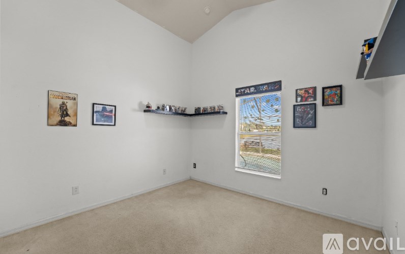A pool inside a house with chairs around it.