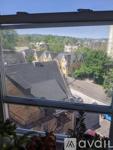 A view from a window looking out at a residential area.