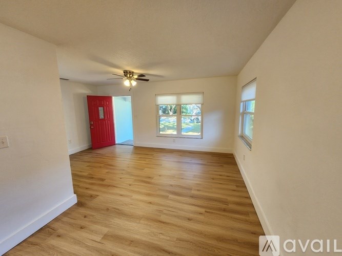 A kitchen with a granite countertop and stainless steel appliances.