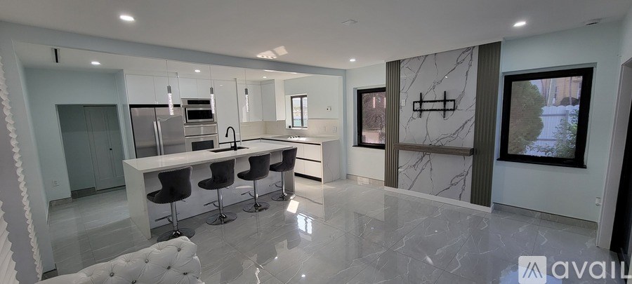 A bathroom with a marble wallpaper and a white toilet.
