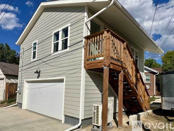 A house with a garage and a deck.
