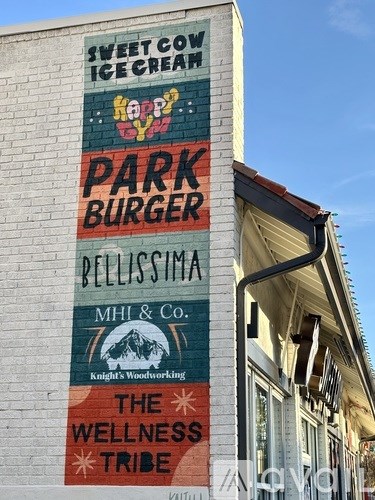 A building with a sign that says "Sweet Corn Ice Cream" on it.