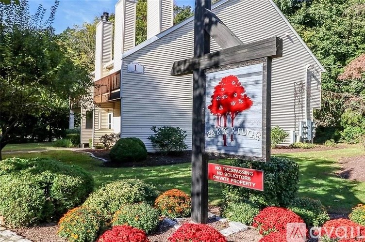 A sign in front of a house warns against trespassing.