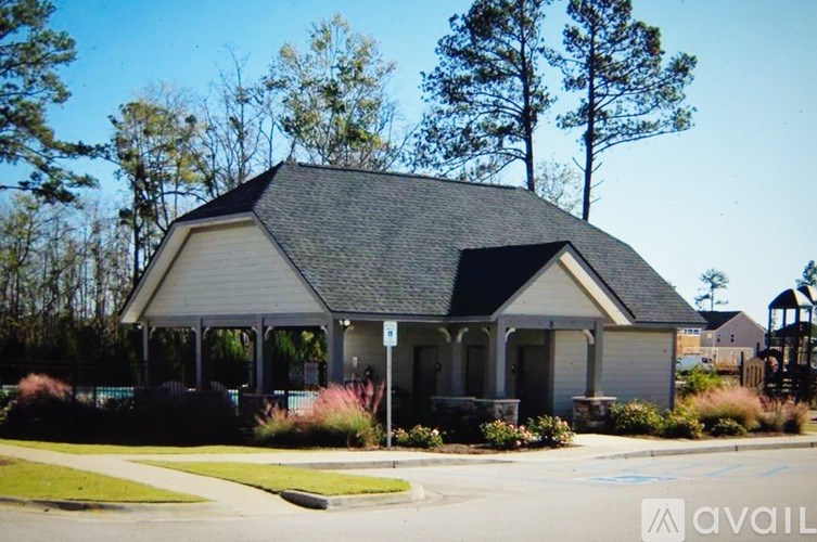 A small house with a porch and a covered entryway.