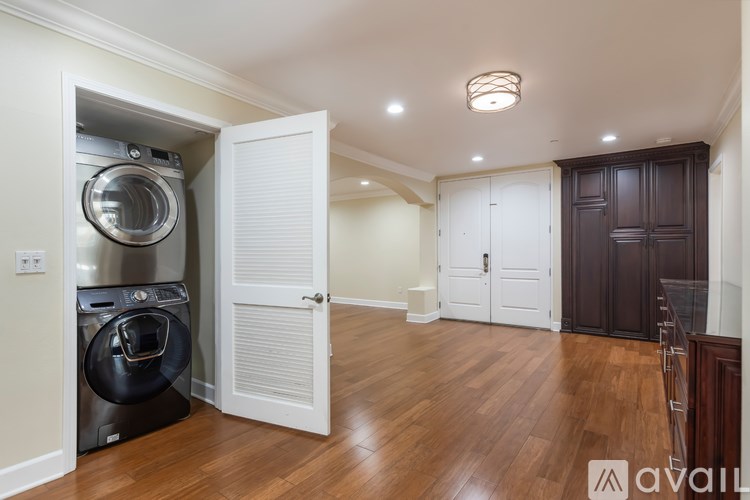 A washer and dryer are tucked into a small space in a home.
