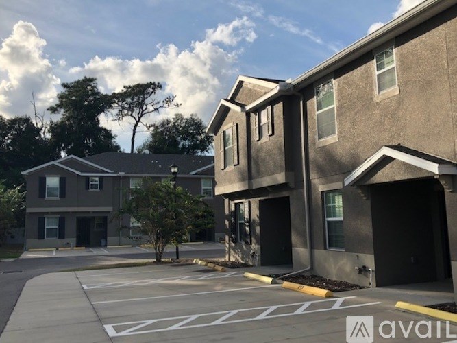 A building with a parking lot in front of it.
