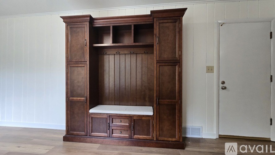 A wooden bunk bed with a bench underneath is available for purchase.