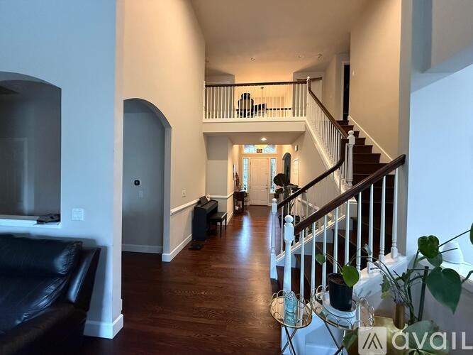 A living room with a couch and a television.