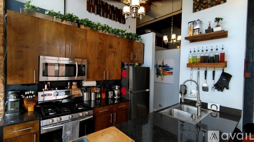 A kitchen with a stove, oven, and sink.