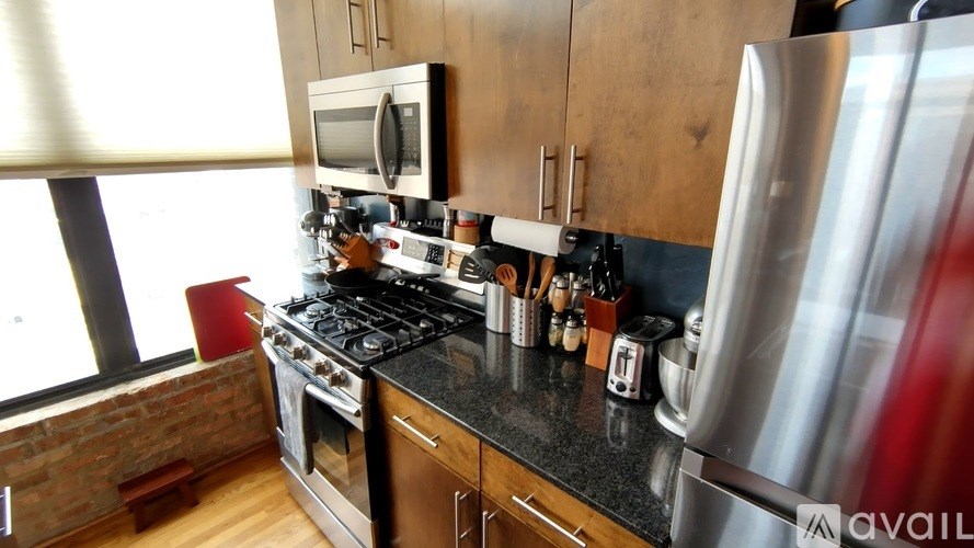 A kitchen with a stove top oven and a microwave.