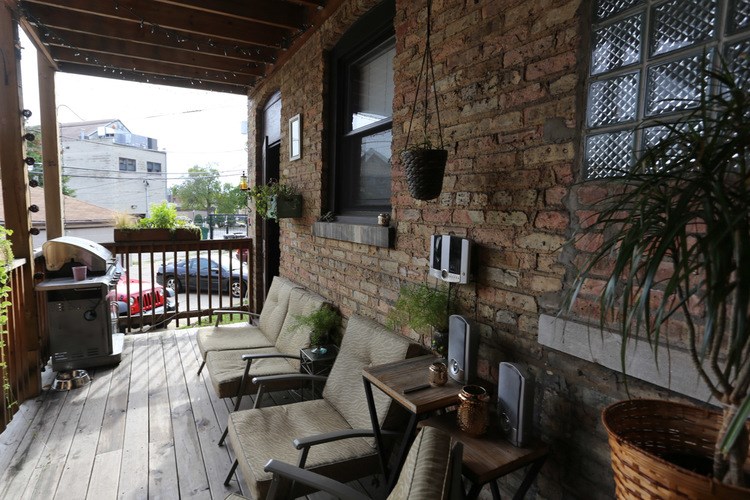 A patio with a table and chairs.
