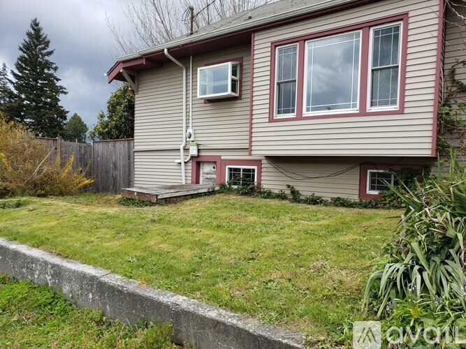 A house with a red door and a small porch.