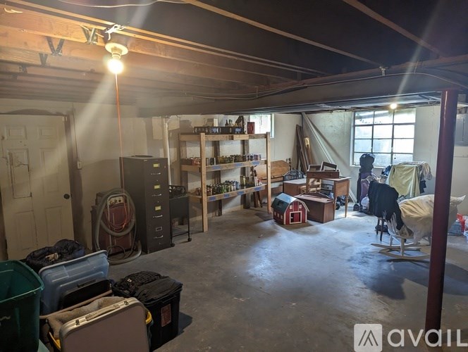 A room with a lot of clutter and a few pieces of furniture.