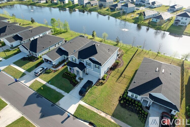 A row of houses with a body of water in the background.