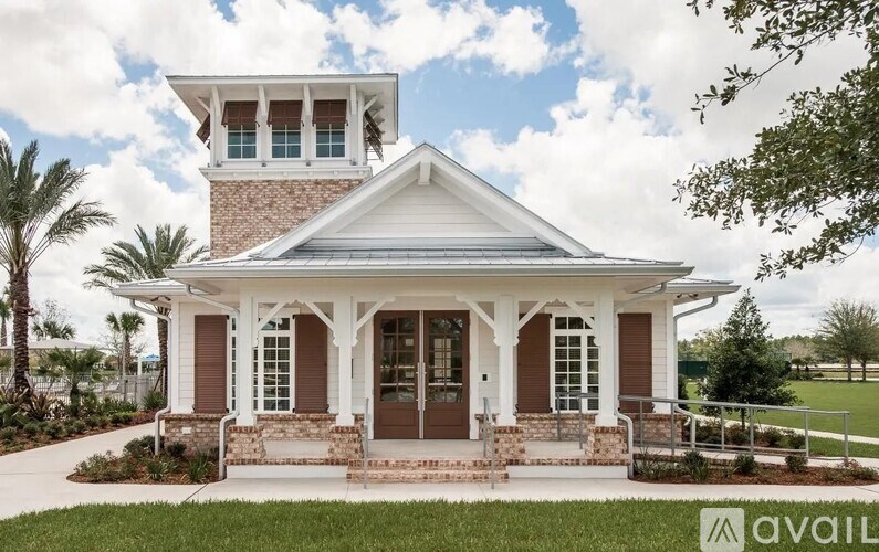 A house with a porch and a balcony is available for sale.