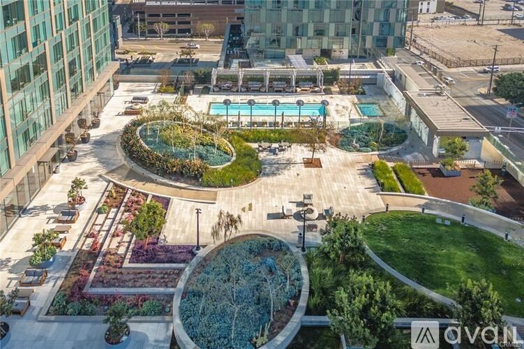 A rooftop garden with a pool and a fountain.