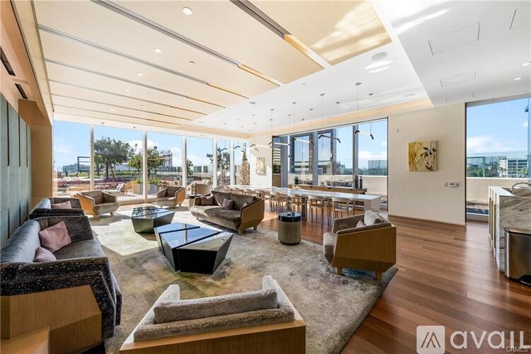A spacious living room with a view of the city.
