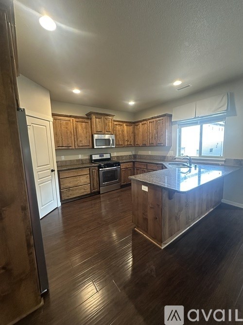 A kitchen with wooden cabinets and a countertop.
