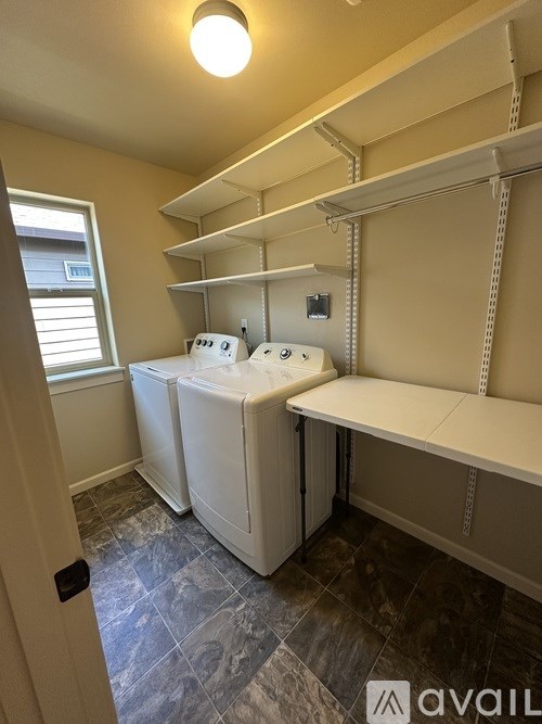 A laundry room with a washer and dryer.