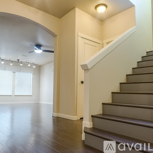 A staircase with a light on the side.