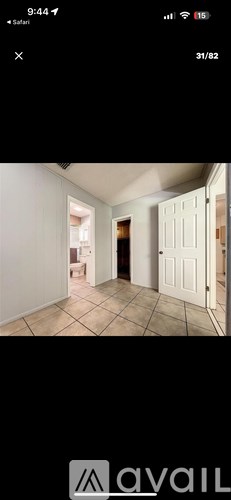 A room with white walls and a tiled floor.