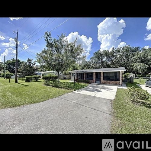 A modern house with a driveway in front of it.