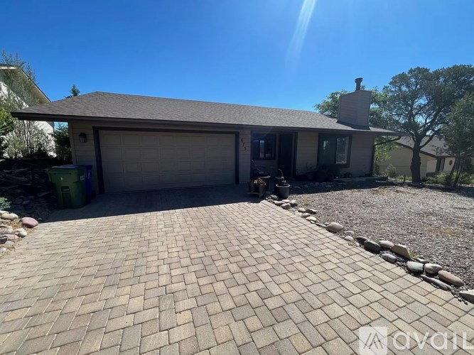 A house with a driveway in front of it.