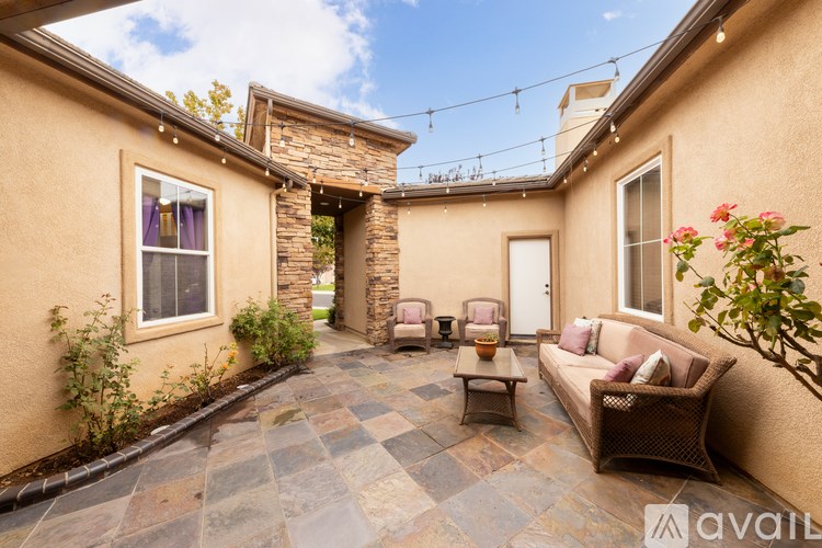 A patio with a table and chairs is available for rent.