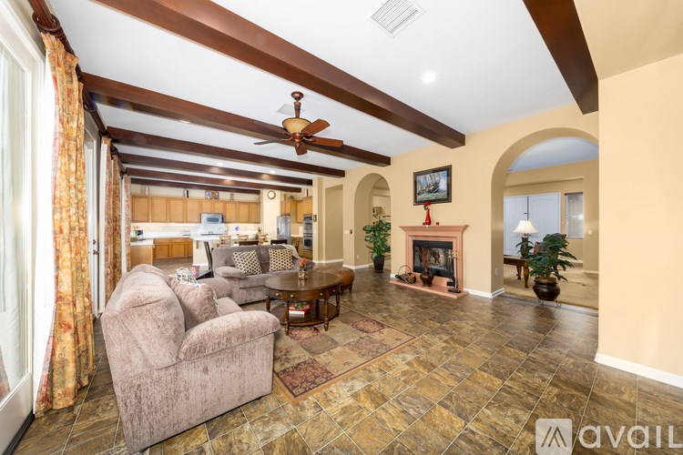 A living room with a fireplace and a couch.