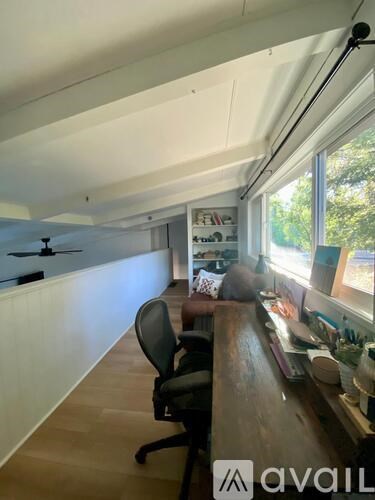 A room with a desk and a chair.