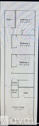 A kitchen with a refrigerator, oven, and microwave.