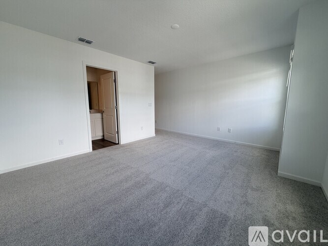 A floor plan of a house with a patio, family room, cafe, kitchen, powder room, entry, and 1-car garage.