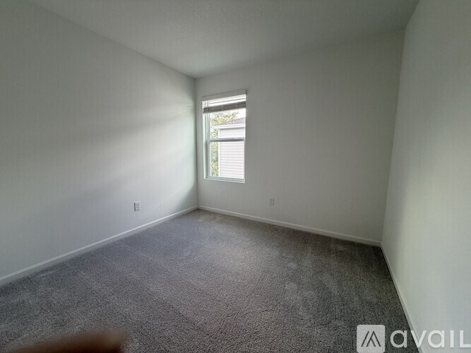 A staircase with a carpeted runner and white walls.