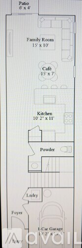 A kitchen with a refrigerator, oven, and microwave.