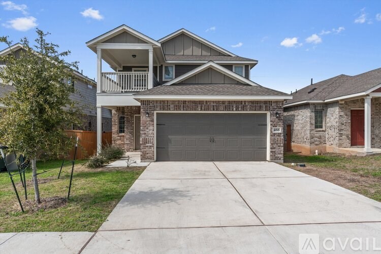 A house with a garage is available for sale.
