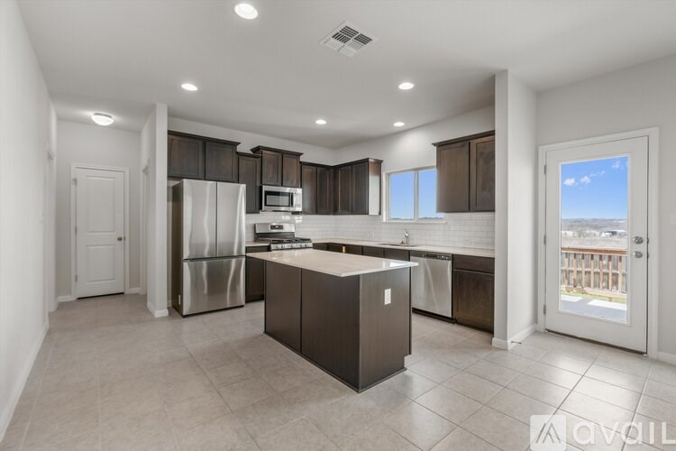 A modern kitchen with a large island in the middle.