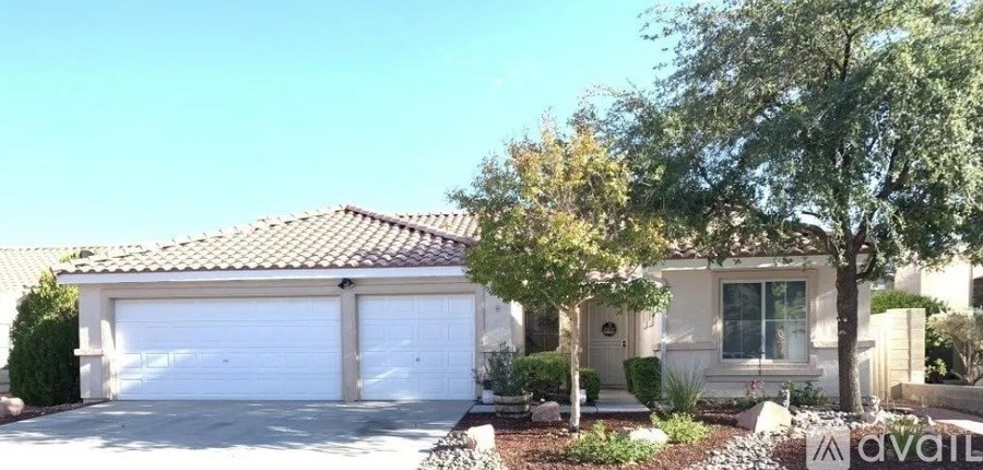A house with a garage is for sale.