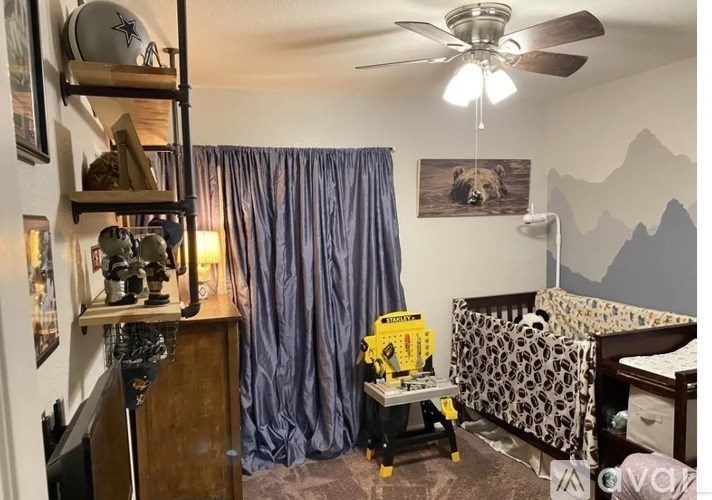 A baby room with a crib and a dresser.