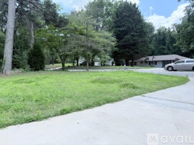 A residential area with a car parked on the side of the road.