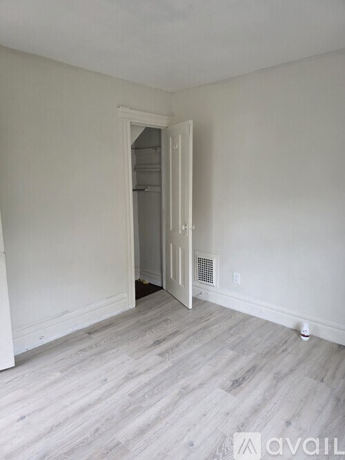 A room with a white door and Avail logo.