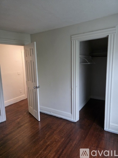 A room with a door open to another room.