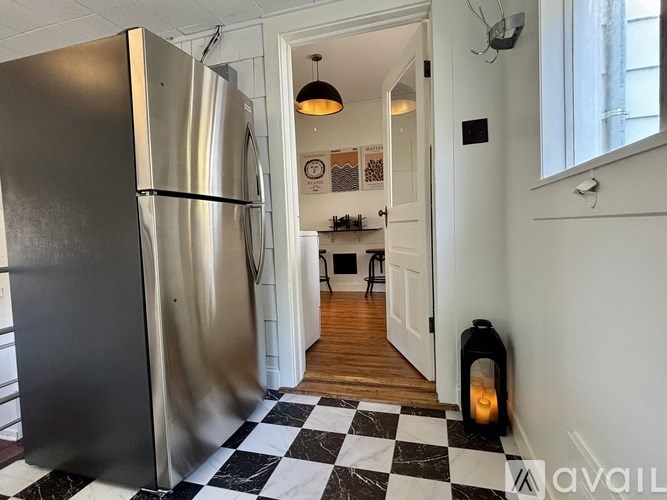 A black and white checkered floor in a hallway.