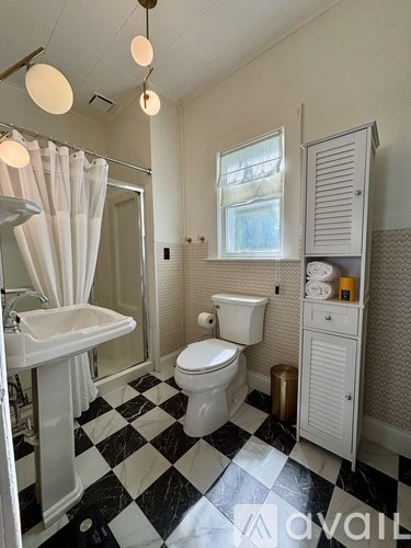 A black and white checkered bathroom floor.